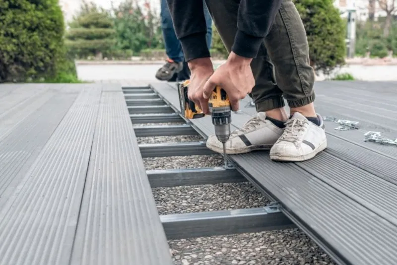 Composite decking boards being installed on a Gold Coast outdoor deck