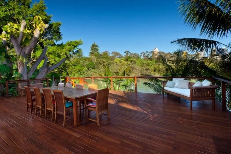 Timber patio deck with outdoor furniture in a Gold Coast backyard