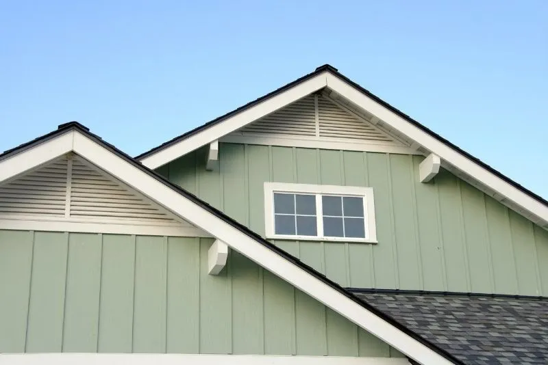 Timber eaves extending from a home's roofline for weather protection