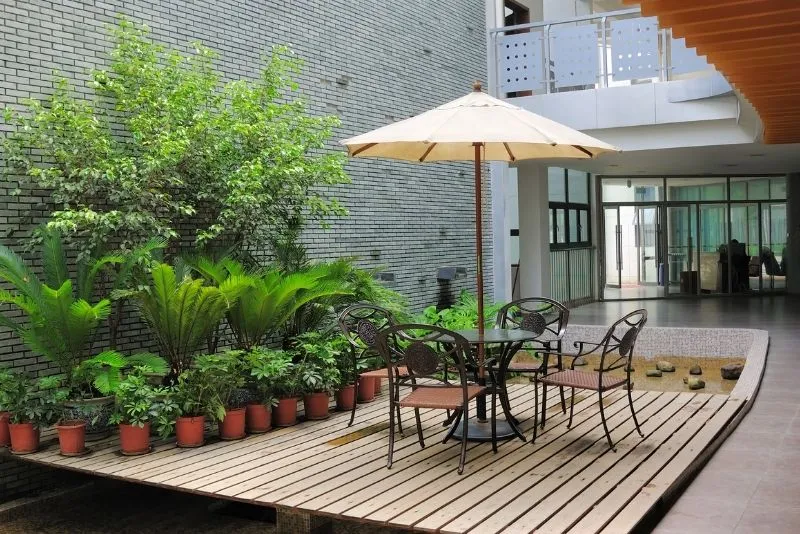 Timber patio deck with seating attached to a Gold Coast home