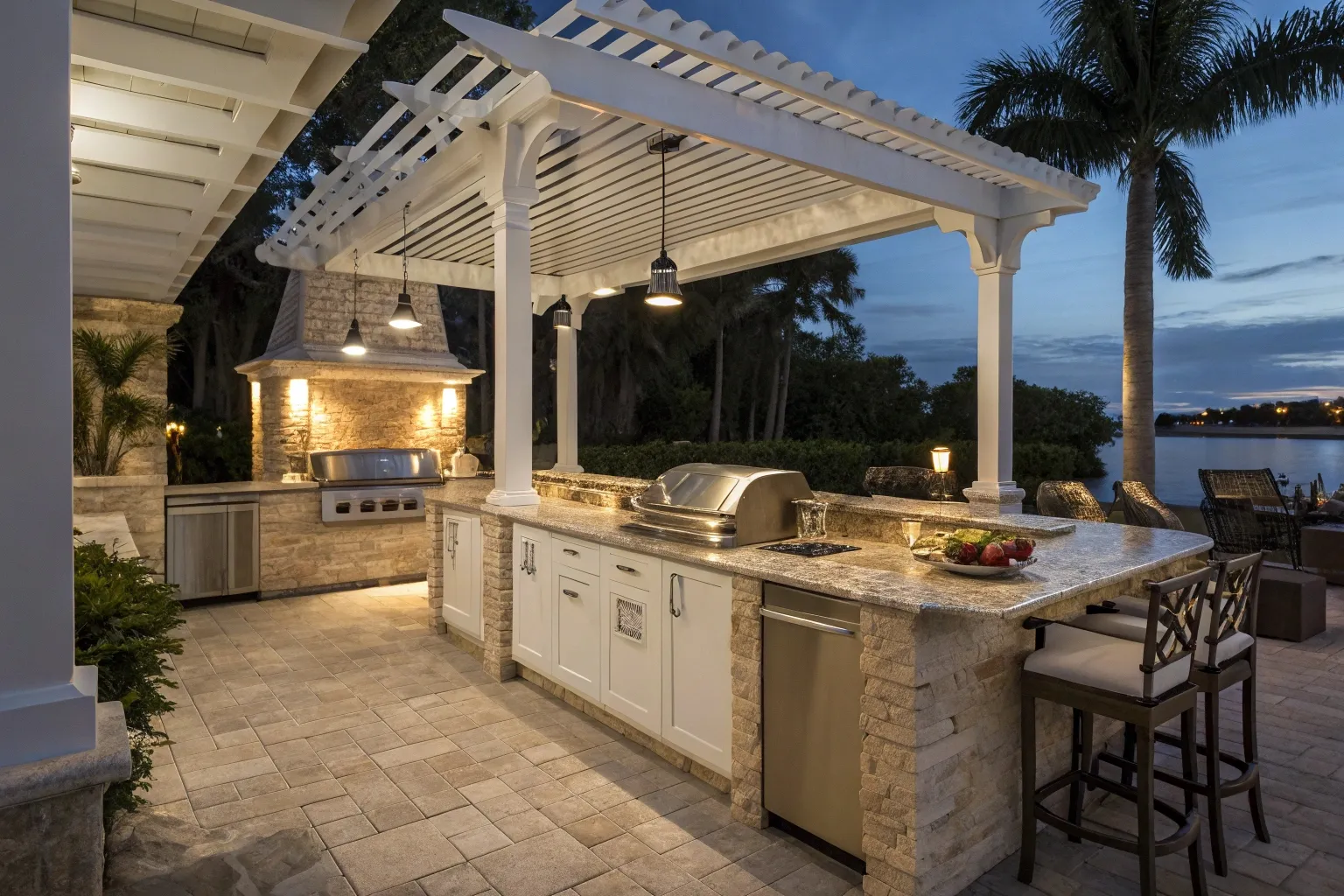 Close-up of a high-end outdoor kitchen integrated beneath a white pergola