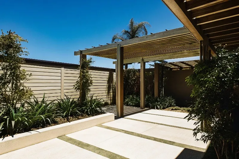 Elevated view of a modern timber pergola seamlessly connected to a backyard entertaining area