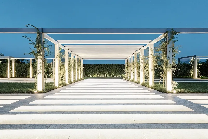 Evening lighting design connecting pergola to surrounding garden pathways for seamless outdoor space integration