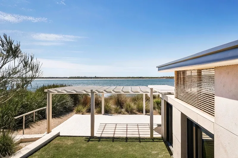 Strategic corner pergola placement in Gold Coast waterfront property framing views and enhancing landscape flow