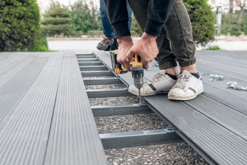 Composite decking boards being installed on a Gold Coast outdoor deck