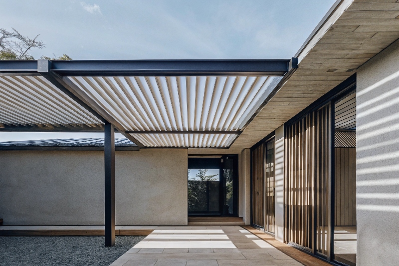 Architectural visualisation showing seamless transition between interior living room and pergola-covered outdoor area with matching flooring materials