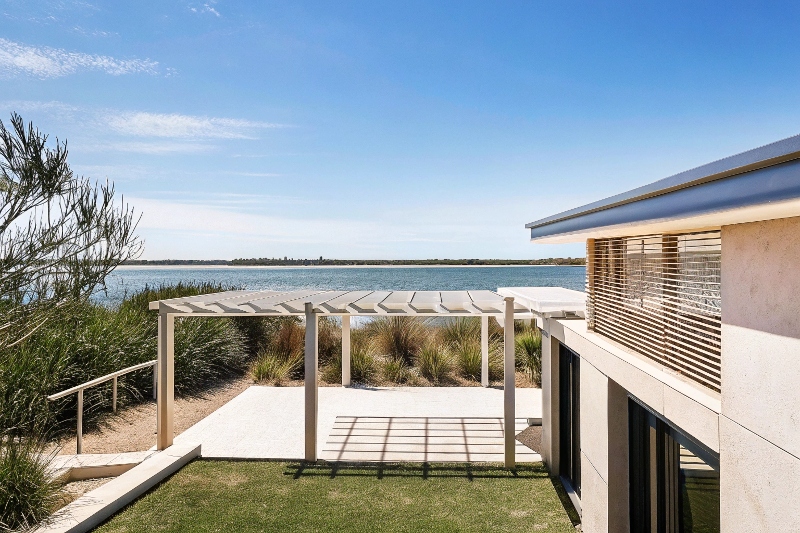 Strategic corner pergola placement in Gold Coast waterfront property framing views and enhancing landscape flow