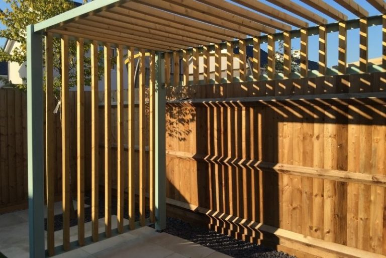 Pergola enclosed with curtains and seasonal decor for year-round outdoor entertaining