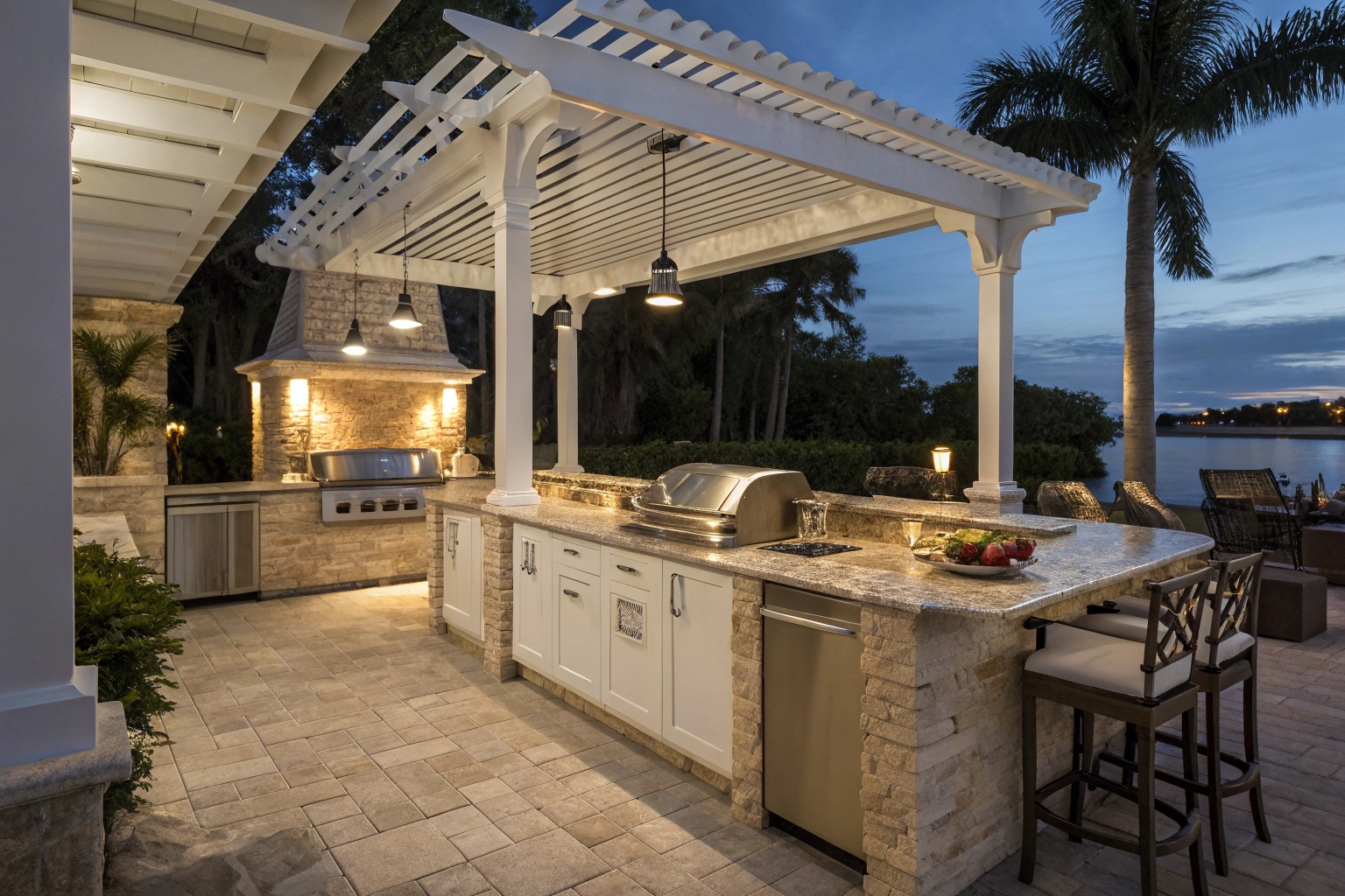 Close-up of a high-end outdoor kitchen integrated beneath a white pergola